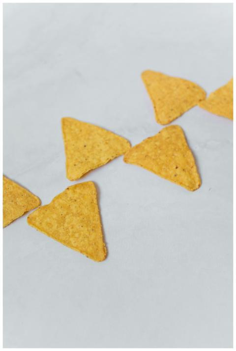 High-quality close-up of crispy tortilla chips, po