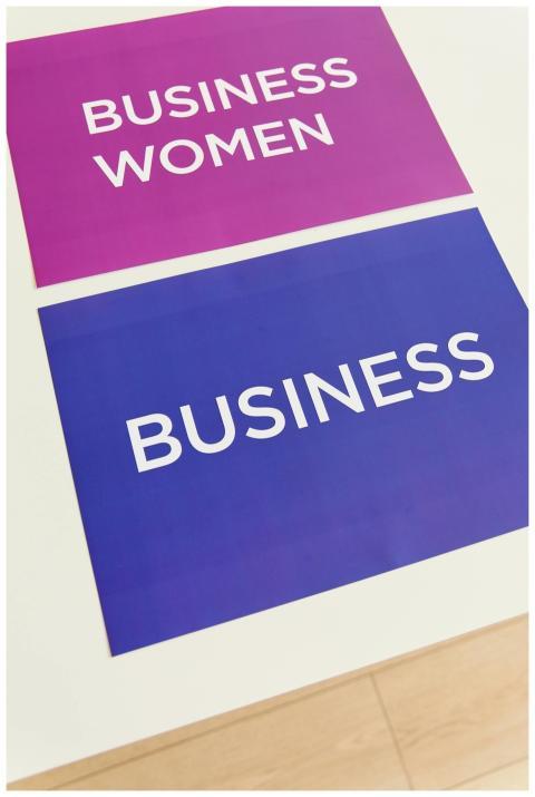 Vibrant business-themed placards on a white desk,