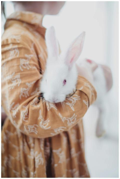 Unrecognizable child in casual dress embracing fun