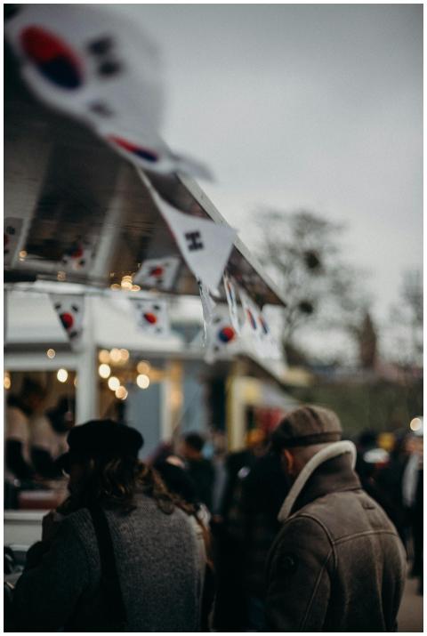 Bustling Korean street food market with people and