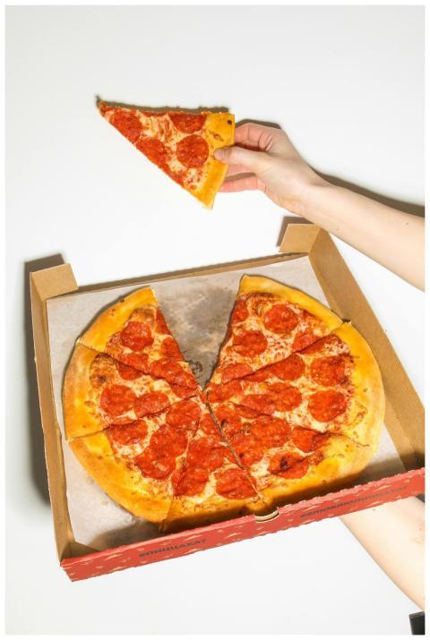 Freshly baked pepperoni pizza in a box, perfect fo