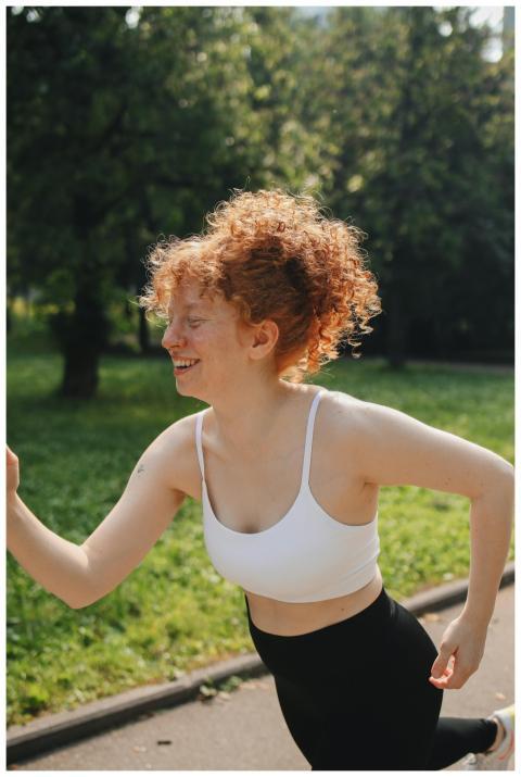 Caucasian woman with curly hair enjoys a morning r