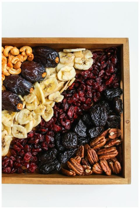 Top view of a wooden tray filled with assorted dri