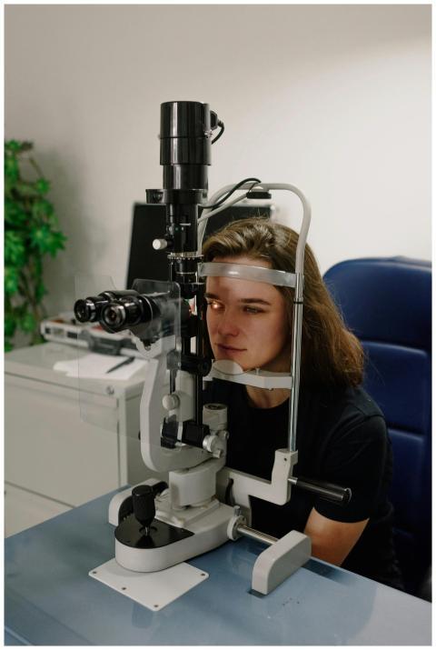 Female patient receiving an eye exam using medical