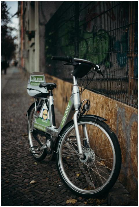 A rental bike on a brick road in Berlin city, perf