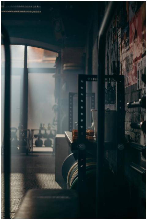 A dark and atmospheric gym interior showcasing wei