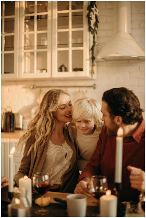 A family enjoying a festive dinner in a warm, cand