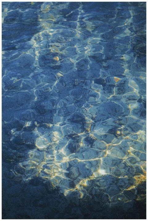 Calm and serene image of rippling blue water with