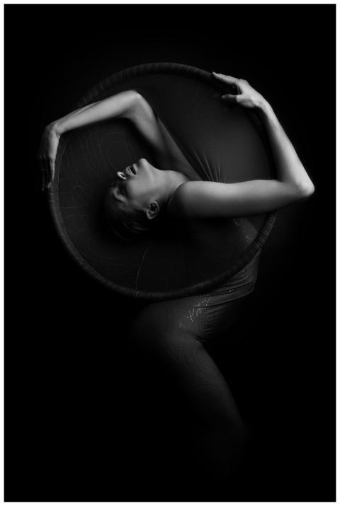 A striking monochrome photograph featuring a woman