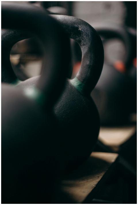 Detailed view of kettlebells lined up in a gym set
