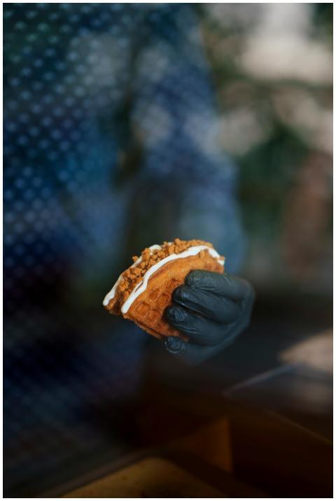 Close-up of a person holding a delicious taco with