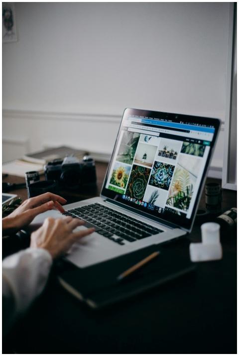 A creative workspace featuring a laptop displaying