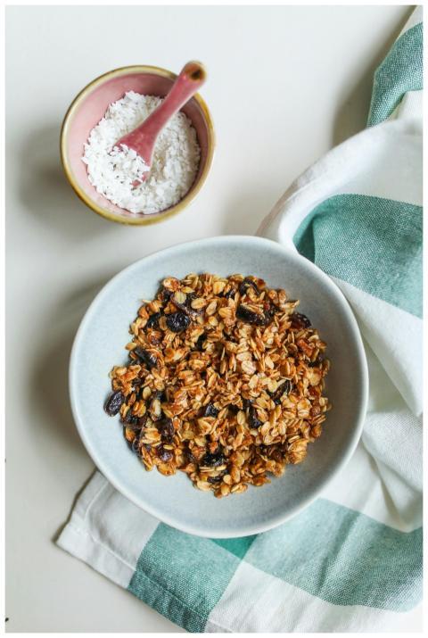 Top view of a bowl of homemade granola with raisin