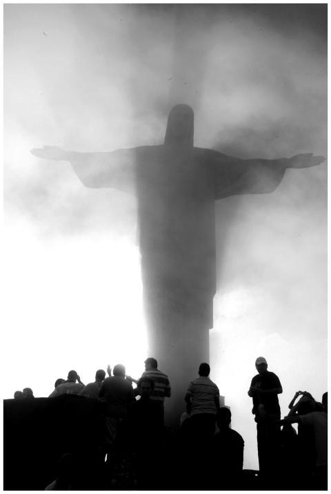 A dramatic silhouette of Christ the Redeemer shrou