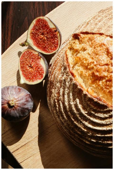 Freshly baked sourdough bread with figs displayed