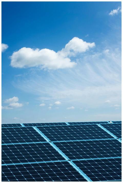 Solar panels under a clear blue sky, symbolizing r