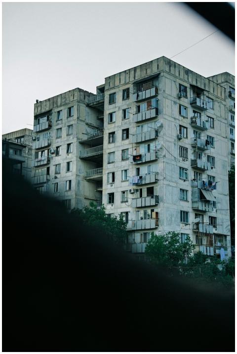 Aging apartment buildings in Tbilisi depict urban