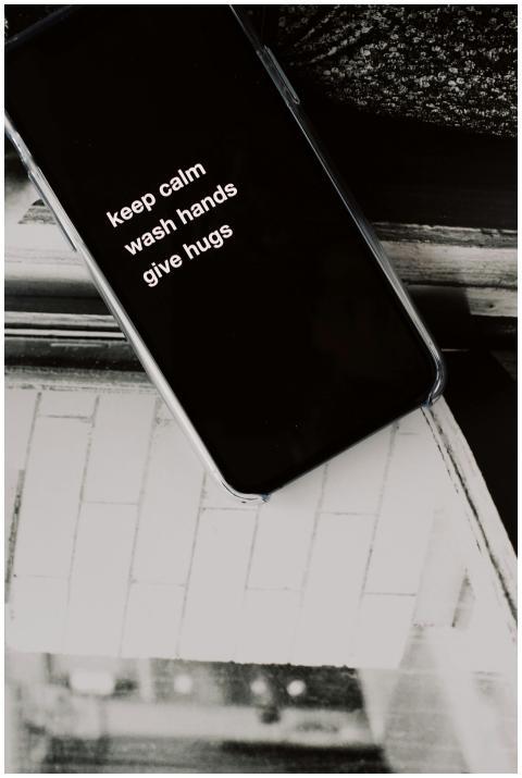 Close-up of a smartphone displaying a motivational