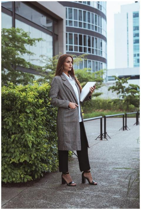 Confident businesswoman in formal attire standing