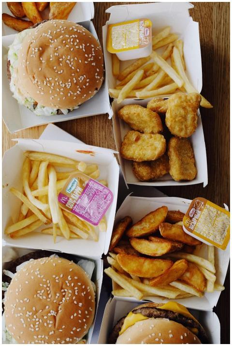 Top view of a fast food meal with burgers, fries,