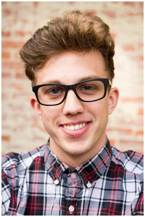 Portrait of a smiling young man wearing eyeglasses