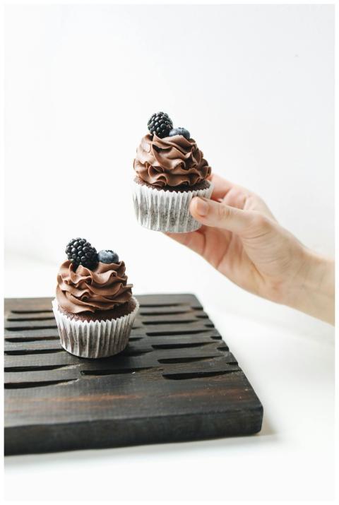 Indulgent chocolate cupcakes topped with fresh bla