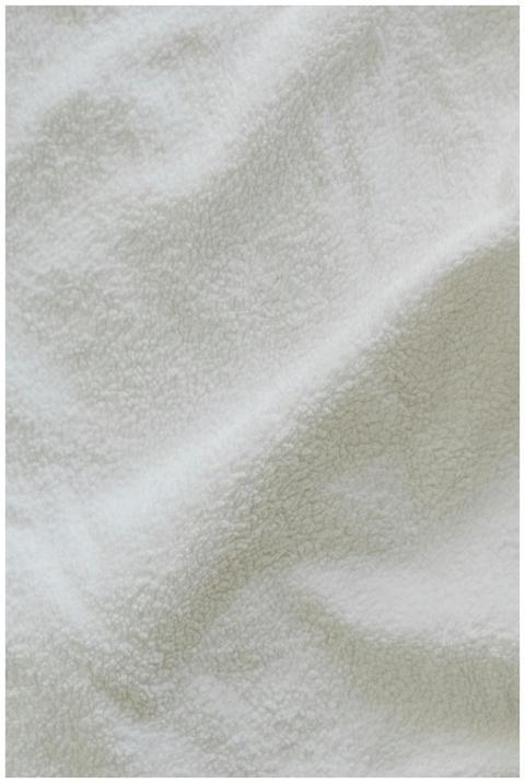 Top view soft white terry cloth with crumbles plac