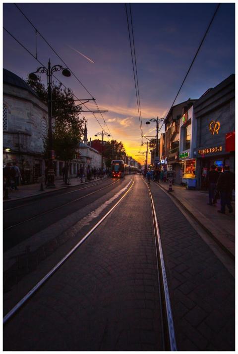 Vibrant sunset over Istanbul street with tram line