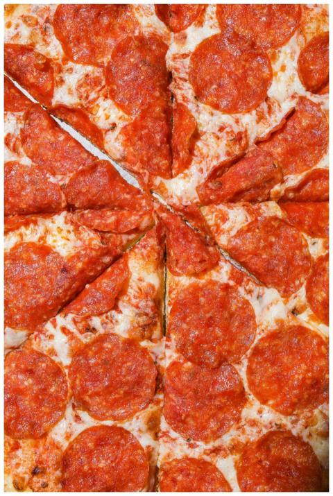 Close-up of a cheesy pepperoni pizza with mouth-wa