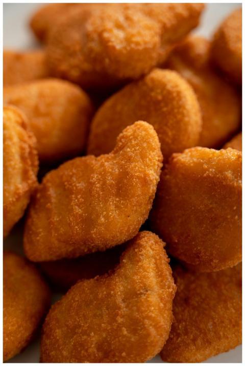 Close-up of crispy, golden-brown chicken nuggets a