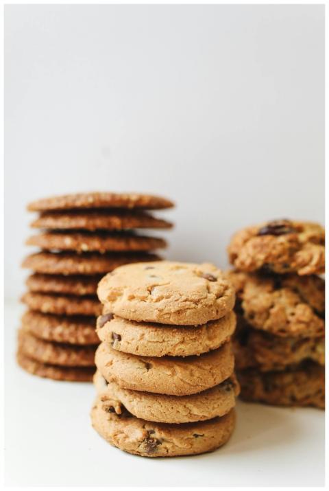 A variety of delicious homemade cookies stacked ne