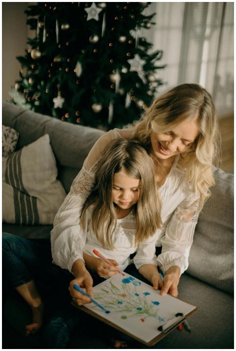 A mother and daughter enjoy drawing together by a