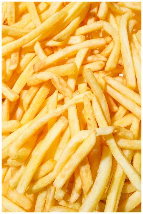 A close-up of delicious crispy French fries with a