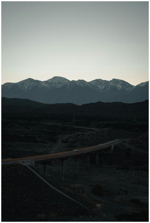 From above magnificent view of rough mountains wit