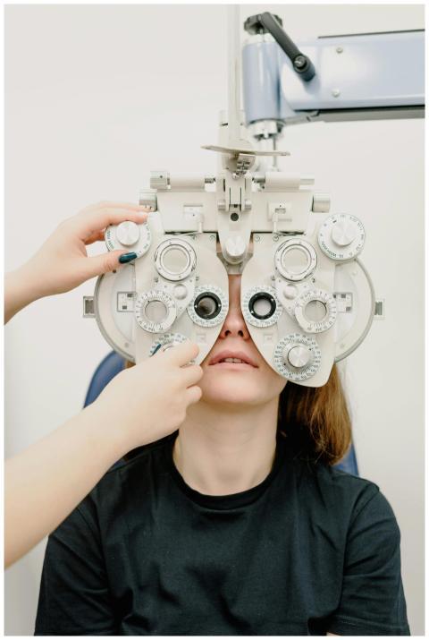 Unrecognizable ophthalmologist using professional