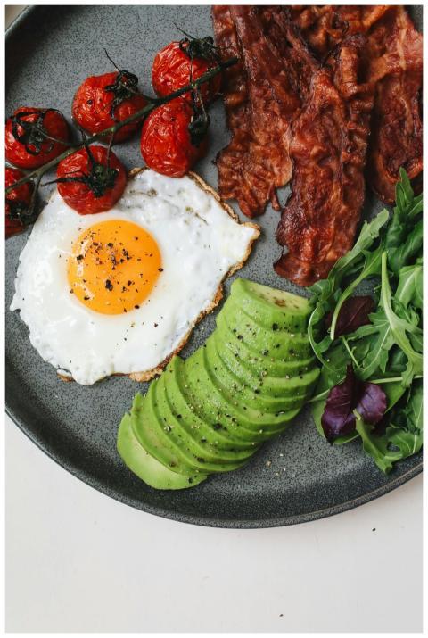Delicious breakfast of crispy bacon, sunny-side eg