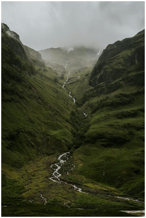 A breathtaking view of a misty highland valley in