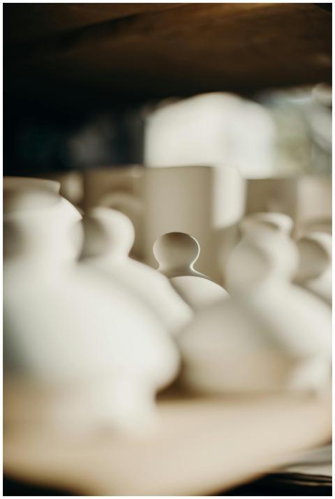 Blurred ceramics on display create an artistic and