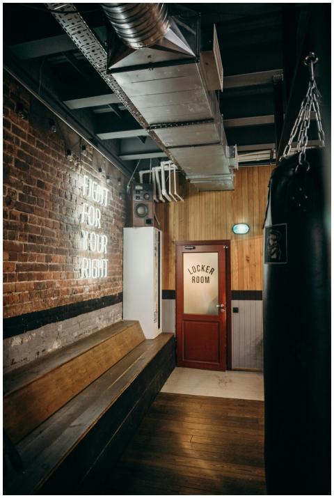 Cozy industrial-style gym locker room featuring a