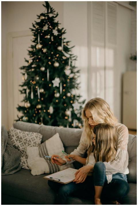 A mother and daughter enjoy a cozy moment by the C