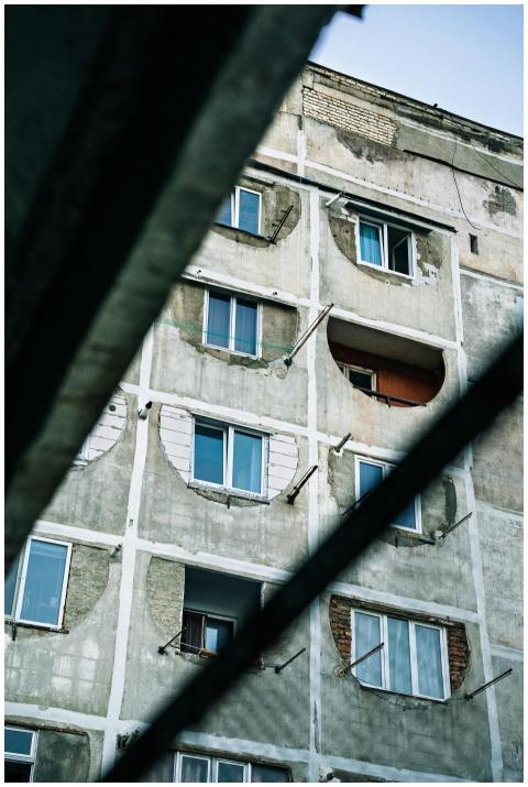 View of a weathered apartment building in Tbilisi