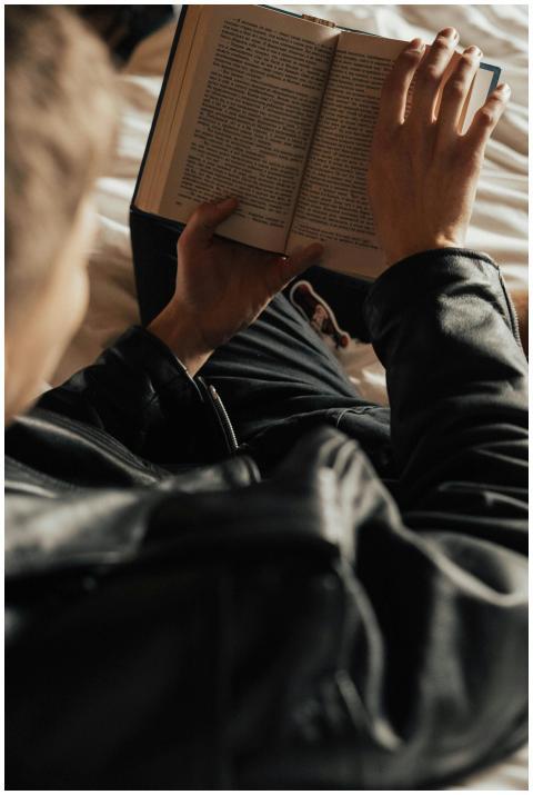 Comfortable reading moment captured from above, sh