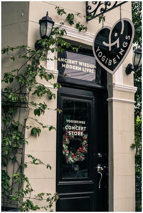 Charming urban storefront of Yogibeings with decor