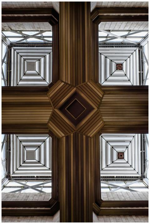 Abstract view of a modern, geometric ceiling inter