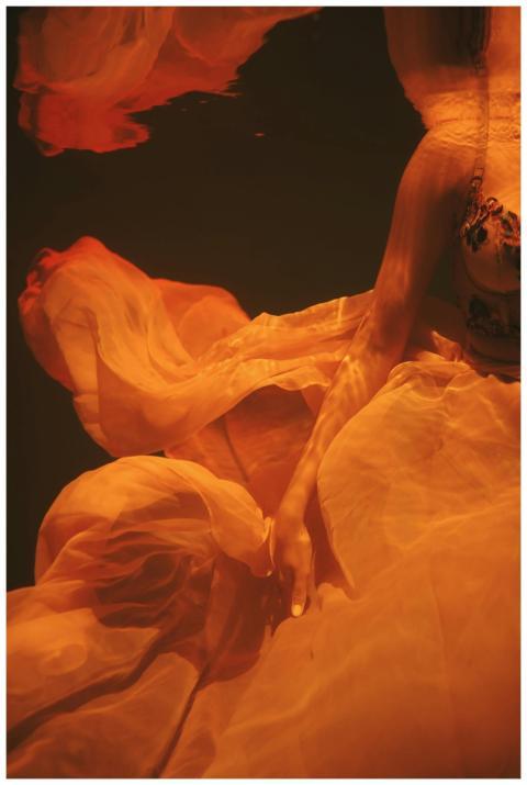 A captivating underwater photo of flowing fabric a