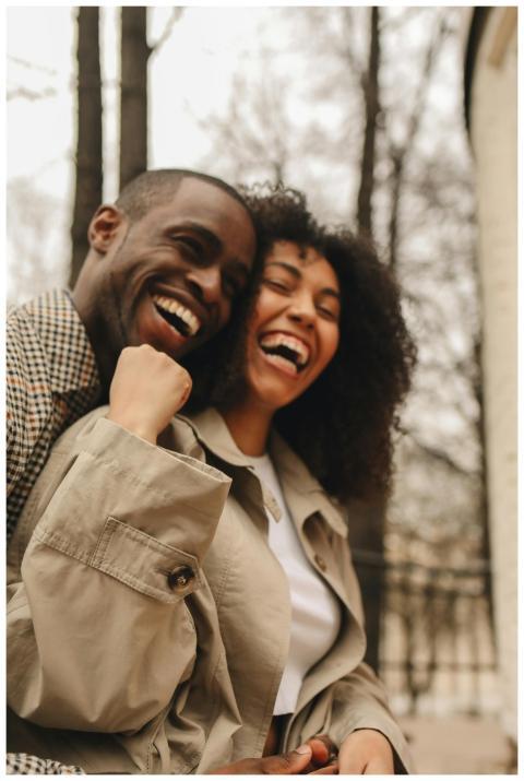 A happy African American couple laughing together