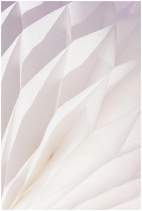 Elegant abstract pattern of folded white paper wit