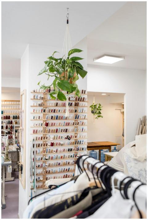 Stand with assorted colorful spools of thread for