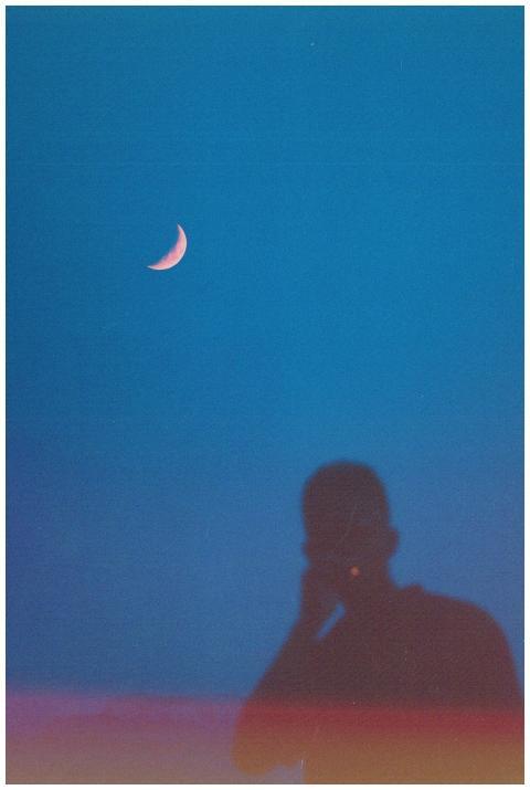 Silhouette of person under a clear night sky with