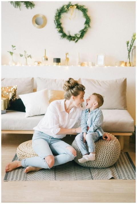 Happy mother and son bonding indoors with stylish